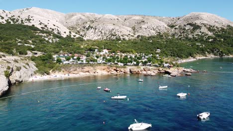 krk island, croatia - coastline with boats, campsite and beaches at kvarner bay, adriatic sea - aerial drone view