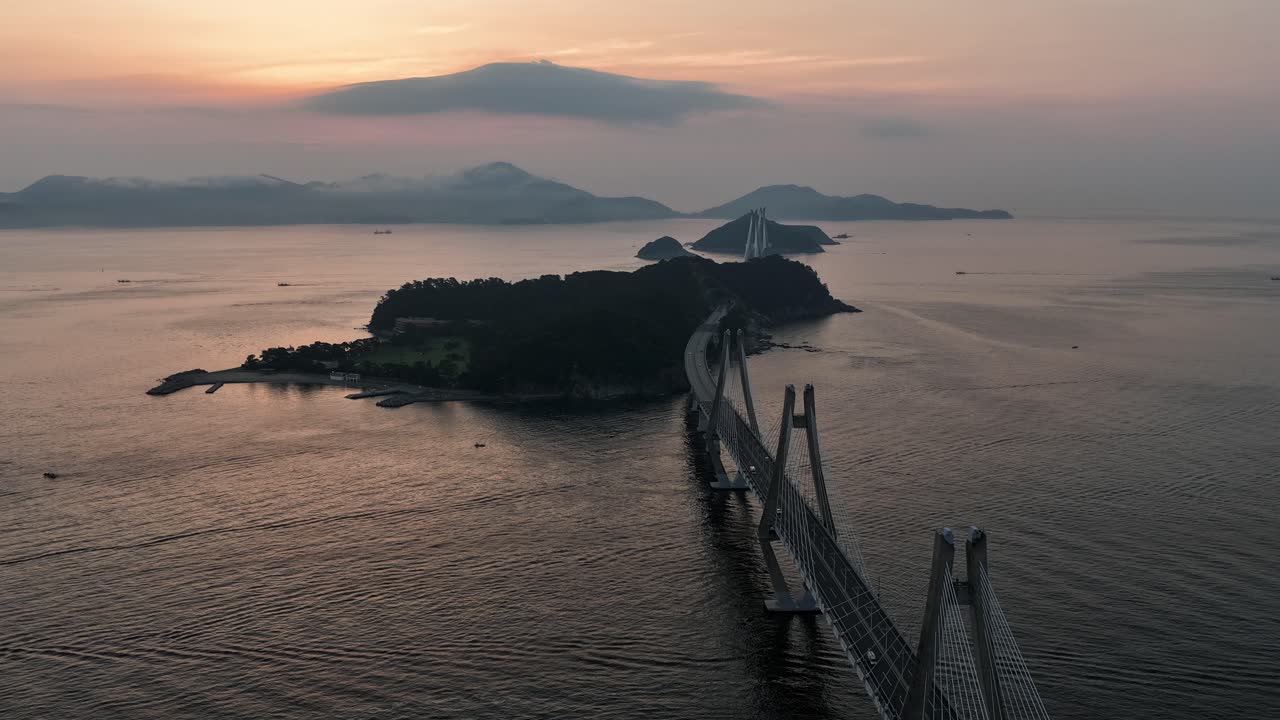 Cinematic drone flight over Geoga Bridge in South Korea at sunrise