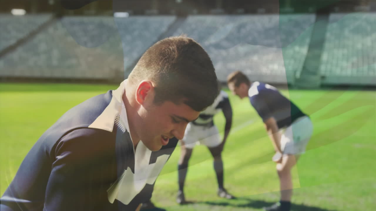 Preparing on grassy field, rugby players in blue uniforms during match animation