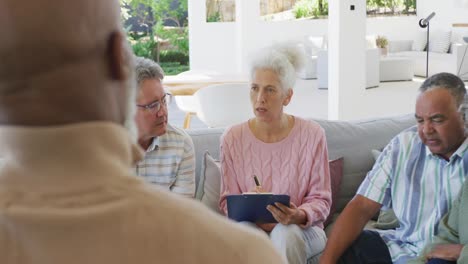 senior diverse people at meeting talking at retirement home