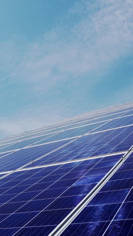 blue photovoltaic solar panels, blue sky. the concept of clean energy, green energy, renewable energy. alternative energy concept. photovoltaic panel. vertical video