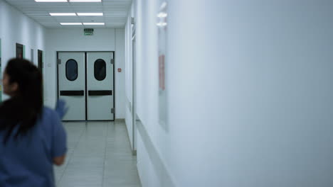 doctors colleagues walking down corridor talking about work. medics consulting.