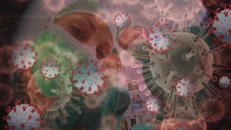 Animation-of-3d-covid-19-cells-floating-over-doctors-wearing-face-masks