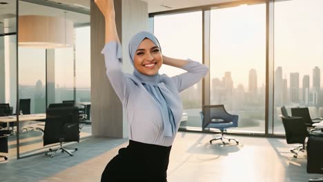 smiling woman in hijab in an office