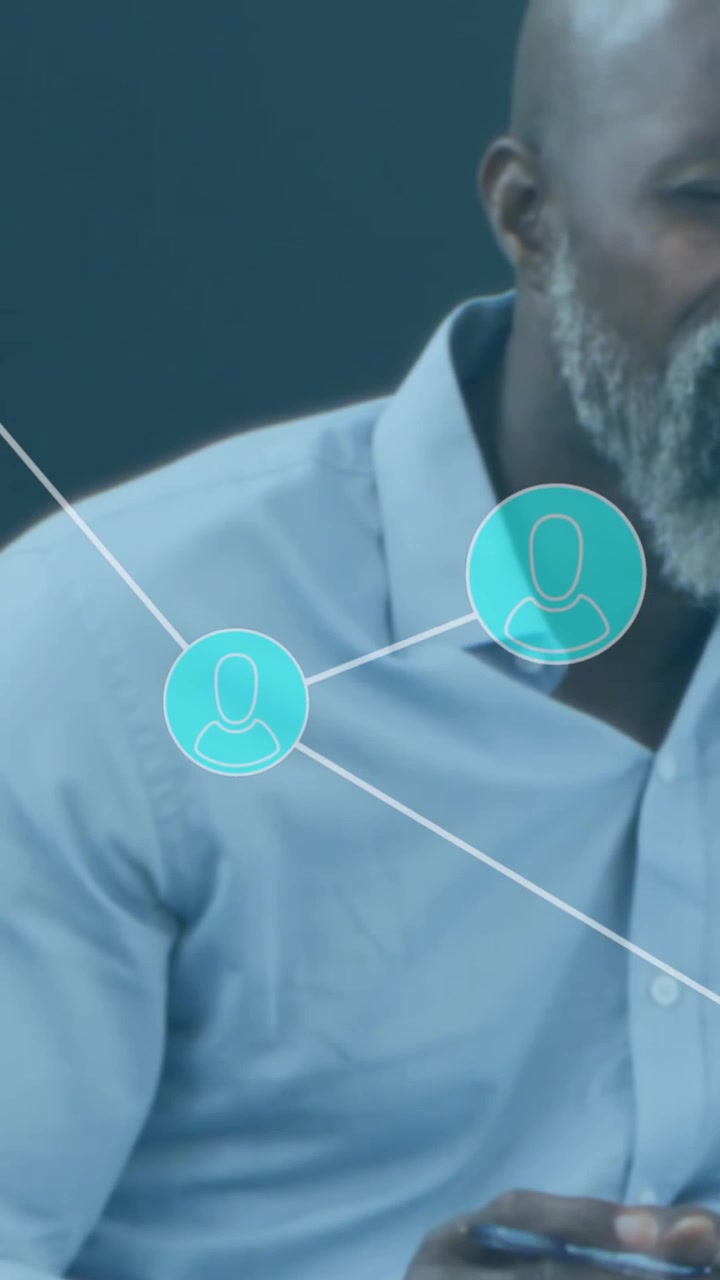 Animation of network of connections and icons over business people in office