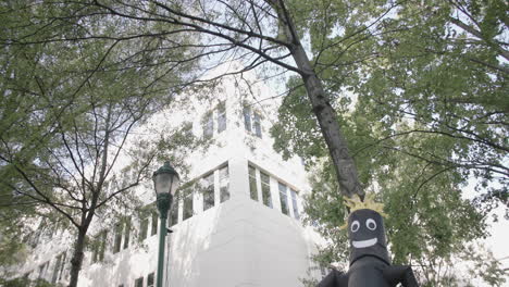 slow motion footage of a black blow up wiggly man at a festival in downtown chattanooga, tn