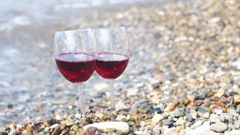 wine glasses on a beach