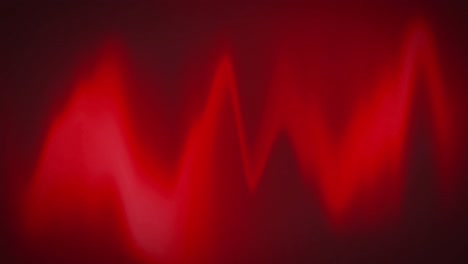 animación digital de las ondas rojas del monitor de frecuencia cardíaca sobre un fondo negro