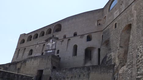 tourists walking around historic castle in naples