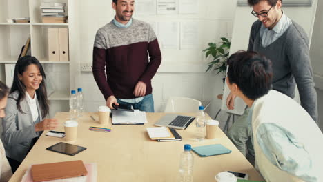 handshake at business meeting showing teamwork