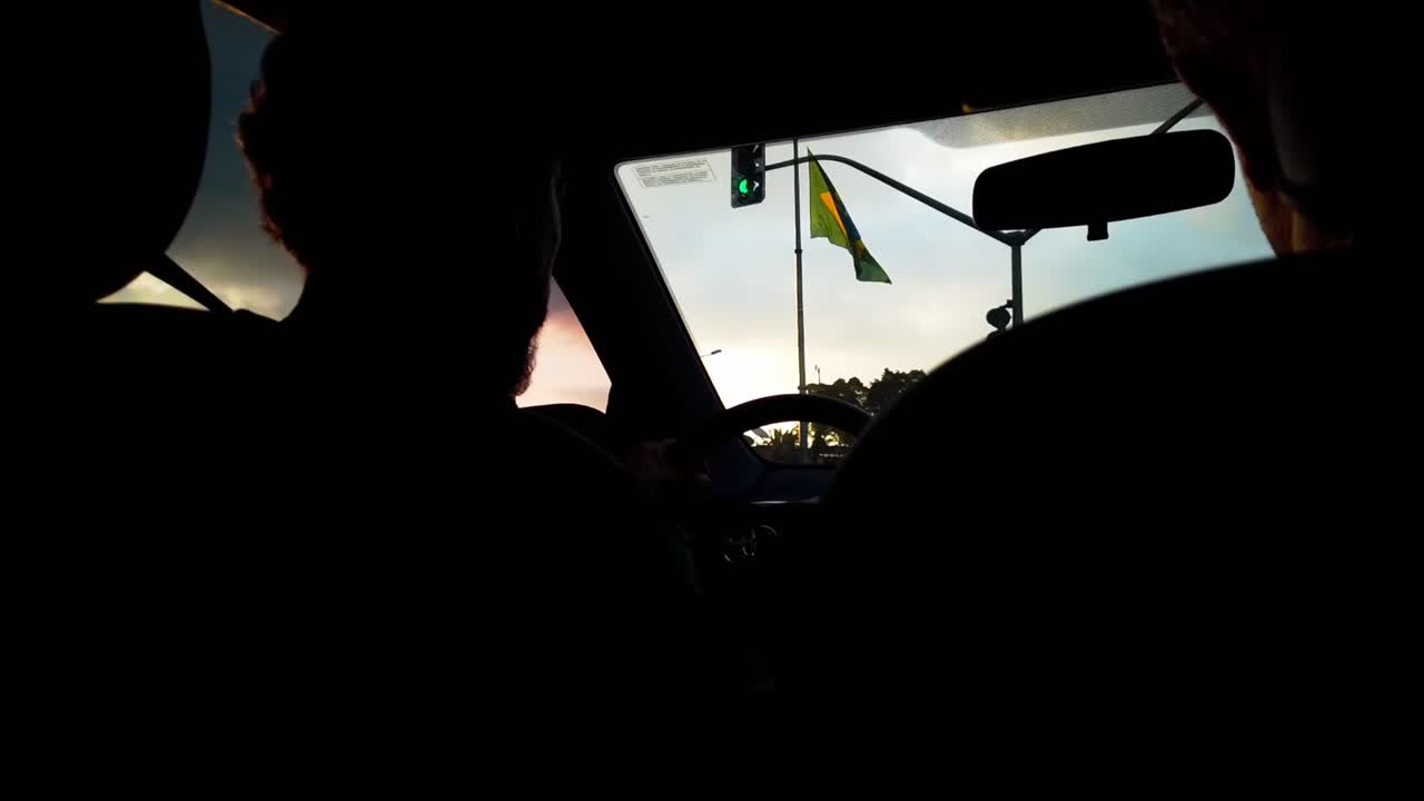 Driving through a Brazilian City at Sunset