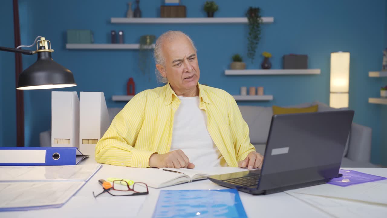 Home office worker old man is angry and furious