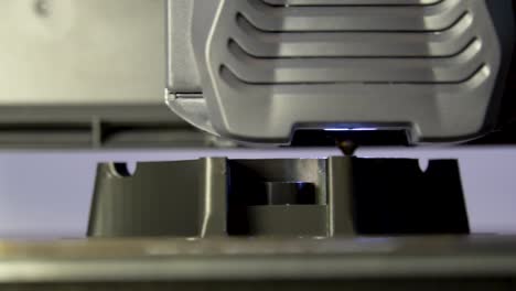 Printing-In-Slow-Motion-With-A-3D-Printer-A-Black-Plastic-Piece