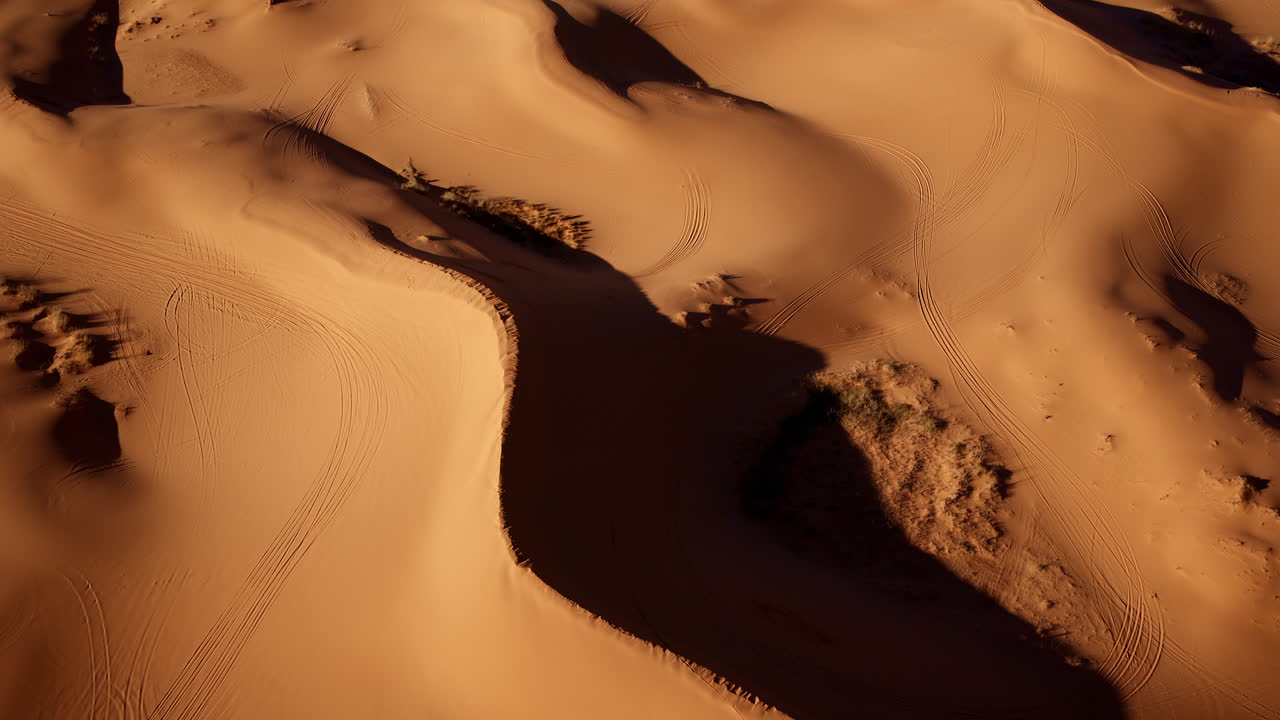 Overhead drone shot offering a surreal glimpse of Southern Utah’s flowing dune formations.