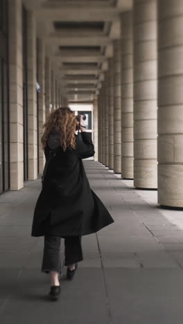 woman walking in a city pathway