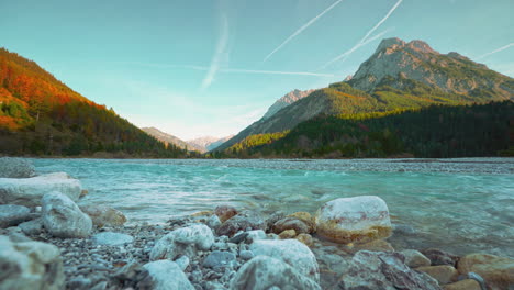 Austria-alps-Mountain-river-with-vibrant-autumn-sky