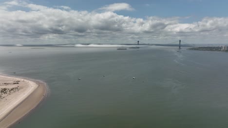 An-aerial-view-of-Gravesend-Bay-in-Brooklyn,-NY-on-a-beautiful-day-with-blue-skies-and-white-clouds