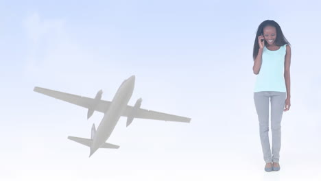 animation of happy african american woman using smartphone, over plane in sky