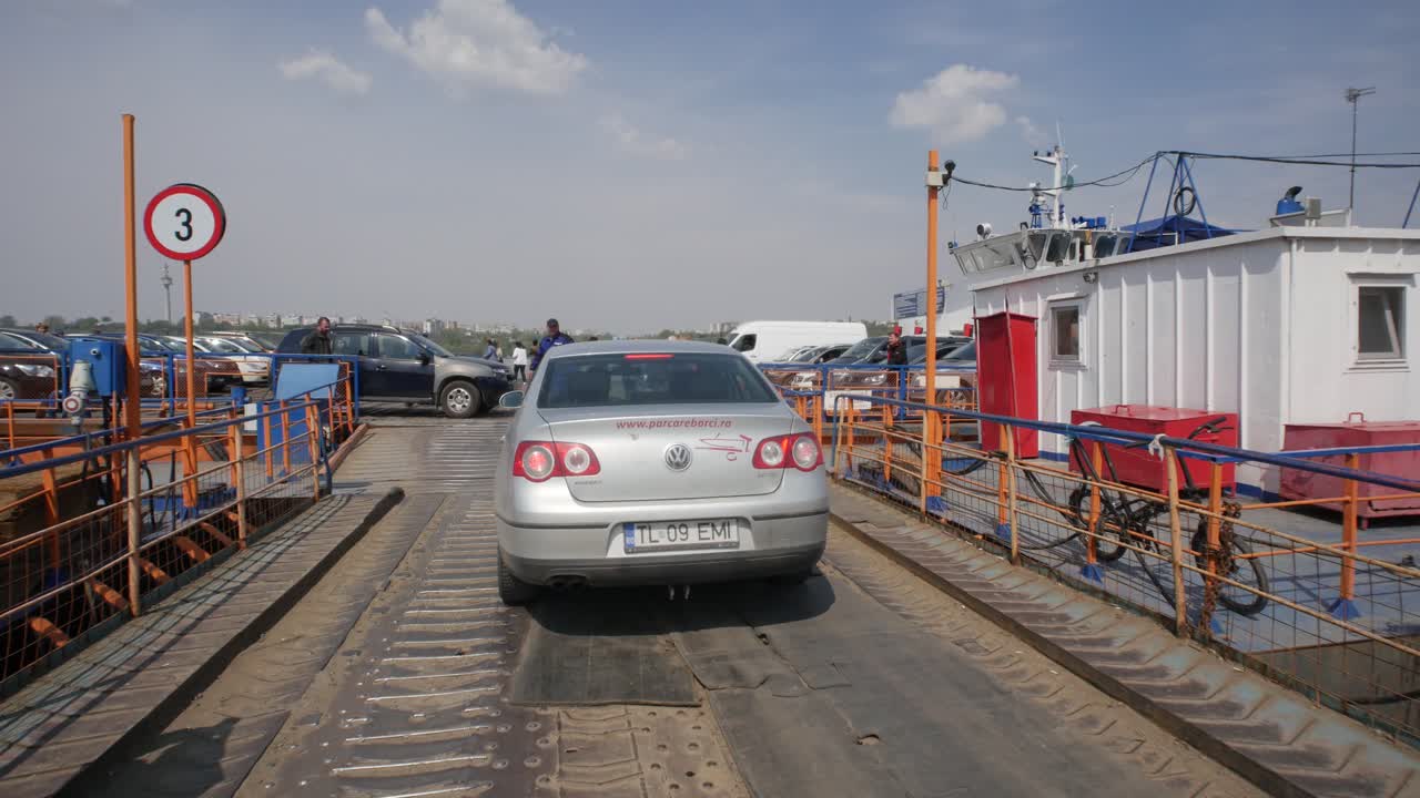 Galatz, Romania. April 21, 2019. Passengers and cars are boarded on a ferry crossing the Danube.