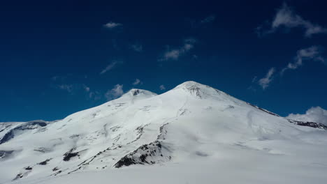 air flight through beautiful view of mount elbrus, north caucasus mountains, russia. it is situated in the western part of the caucasus and is the highest peak of the caucasus mountains.