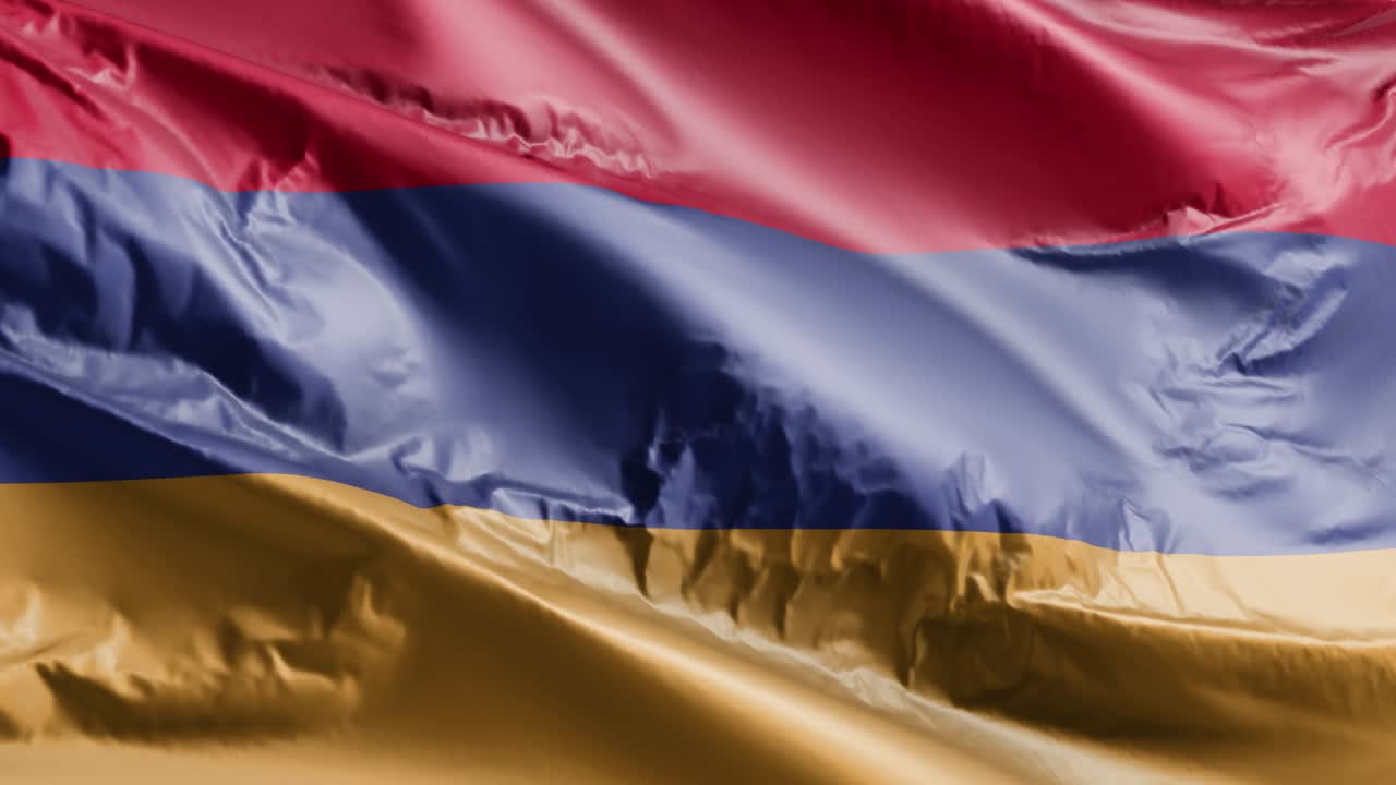 アーメニア国旗は風の輪に振り回されアーメニアの旗は風で振り回される 完全な充填の背景 10秒のループ