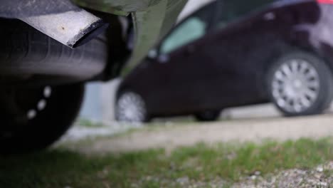 harmful toxic exhaust gas pollution - carbon monoxide, unburned hydrocarbons, nitrogen and sulfur oxides, carbonaceous particulate - rear view of a car with engine running - global warming risk