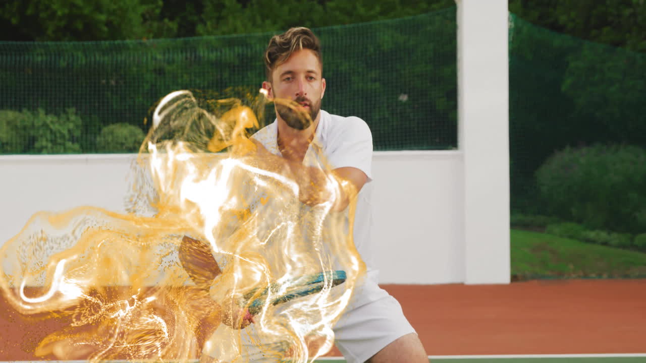 Male tennis player crouching on red clay court, showcasing golden flame effect on racket for sports