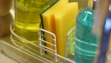 person cleaning with hand sanitizer and sponge.