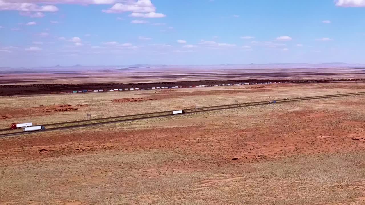 Drone over the Arizona desert near Winslow with the i40 in the background.