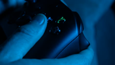 Gamer-Playing-Late-Using-Controller-with-Blue-Filter-Lighting