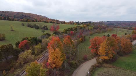 typical autumn landscape in rural caledon, car traveling alone, canada