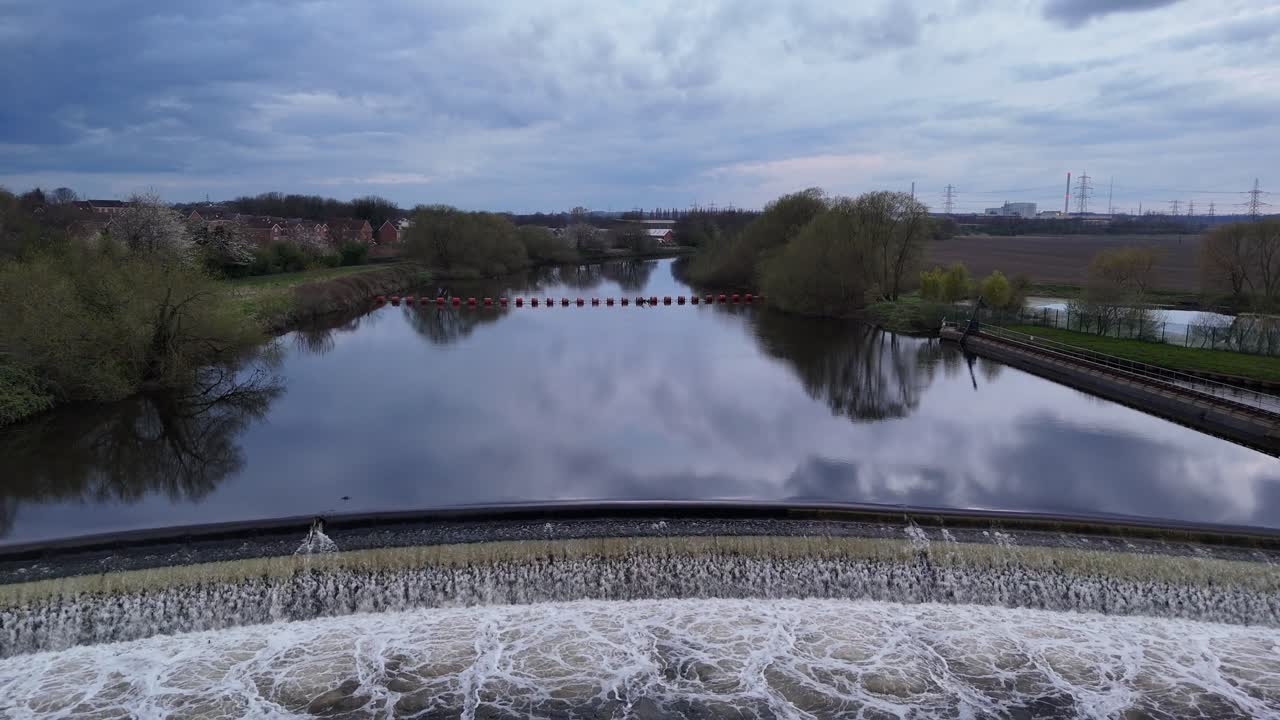 Water rushing over Knottingley Weir Hydroelectric power plant UK drone,aerial