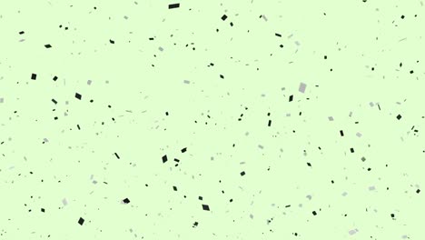 Animation-of-multi-coloured-confetti-falling-on-green-background