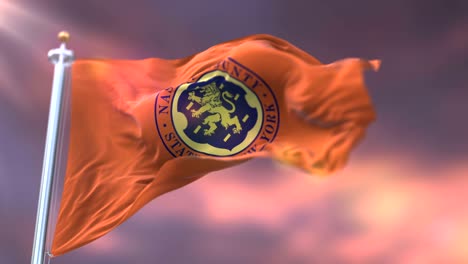 flag of nassau county at sunset, state of new york, in united states - loop