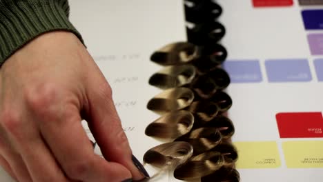 a girl shows some strands of hair