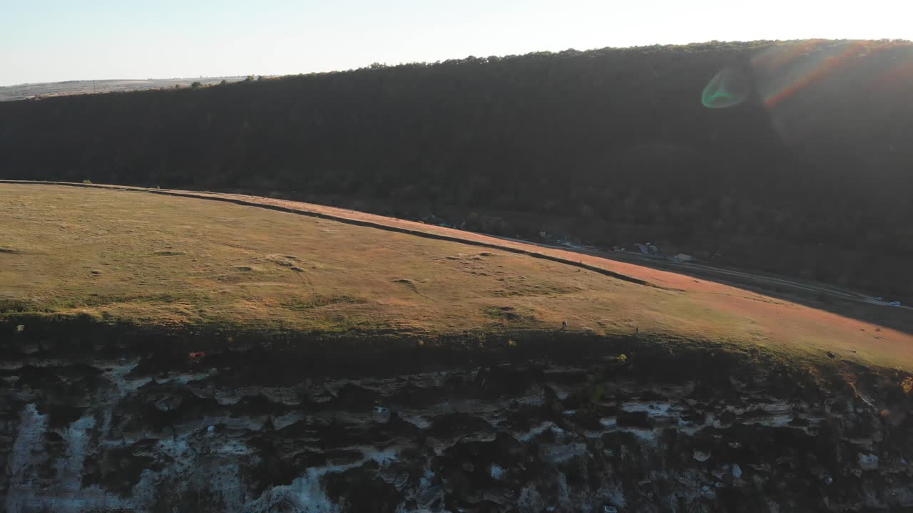 Aerial view of a rural landscape with fields and hills