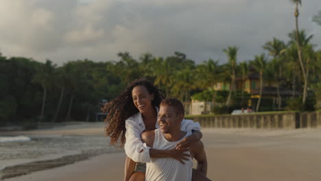 young man piggybacking her girlfriend