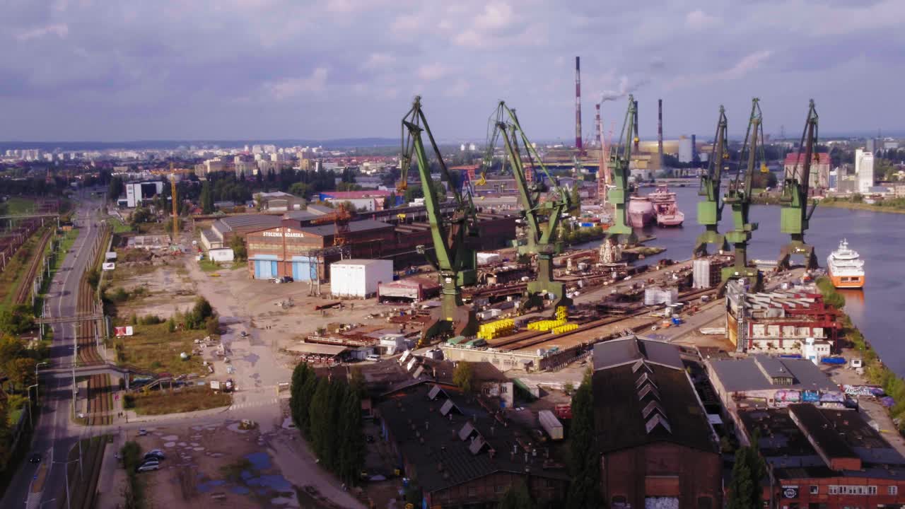 Industrial Area Of Shipyard and cranes In Gdansk, Poland. Aerial view.