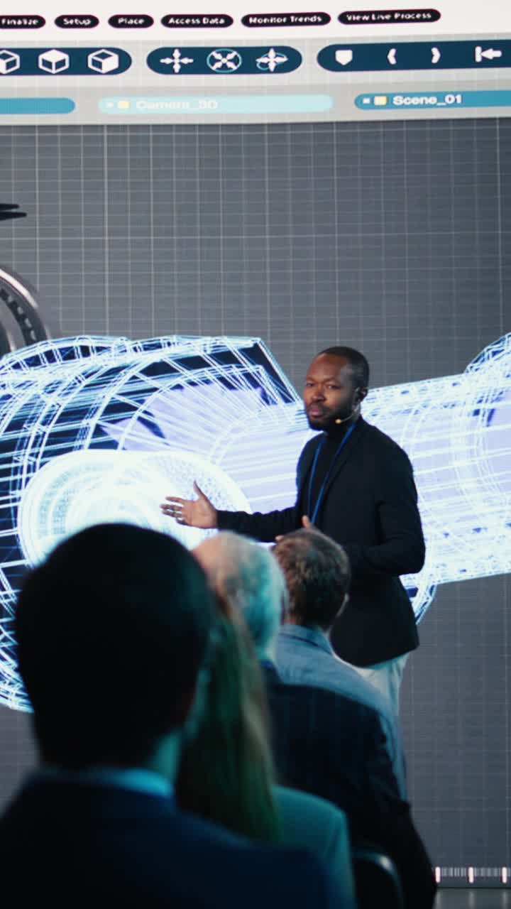 Vertical Video Male speaker hosts heavy industrial presentation with turbines and gear systems