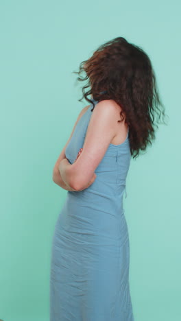 cheerful funny bully young woman showing tongue making silly faces fooling around joking teasing
