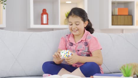 girl child playing with a intelligence cube.