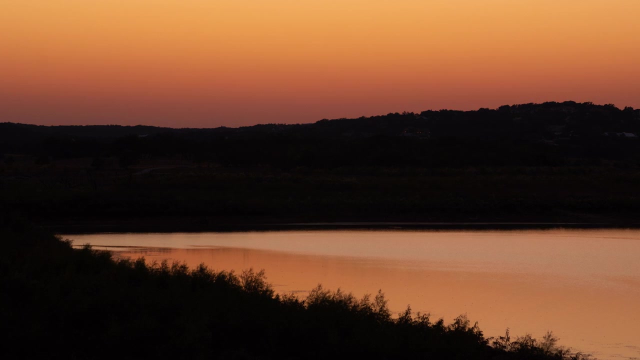 Dramatic Timelapse just after sunset of vibrant orange and pink colors, twilight