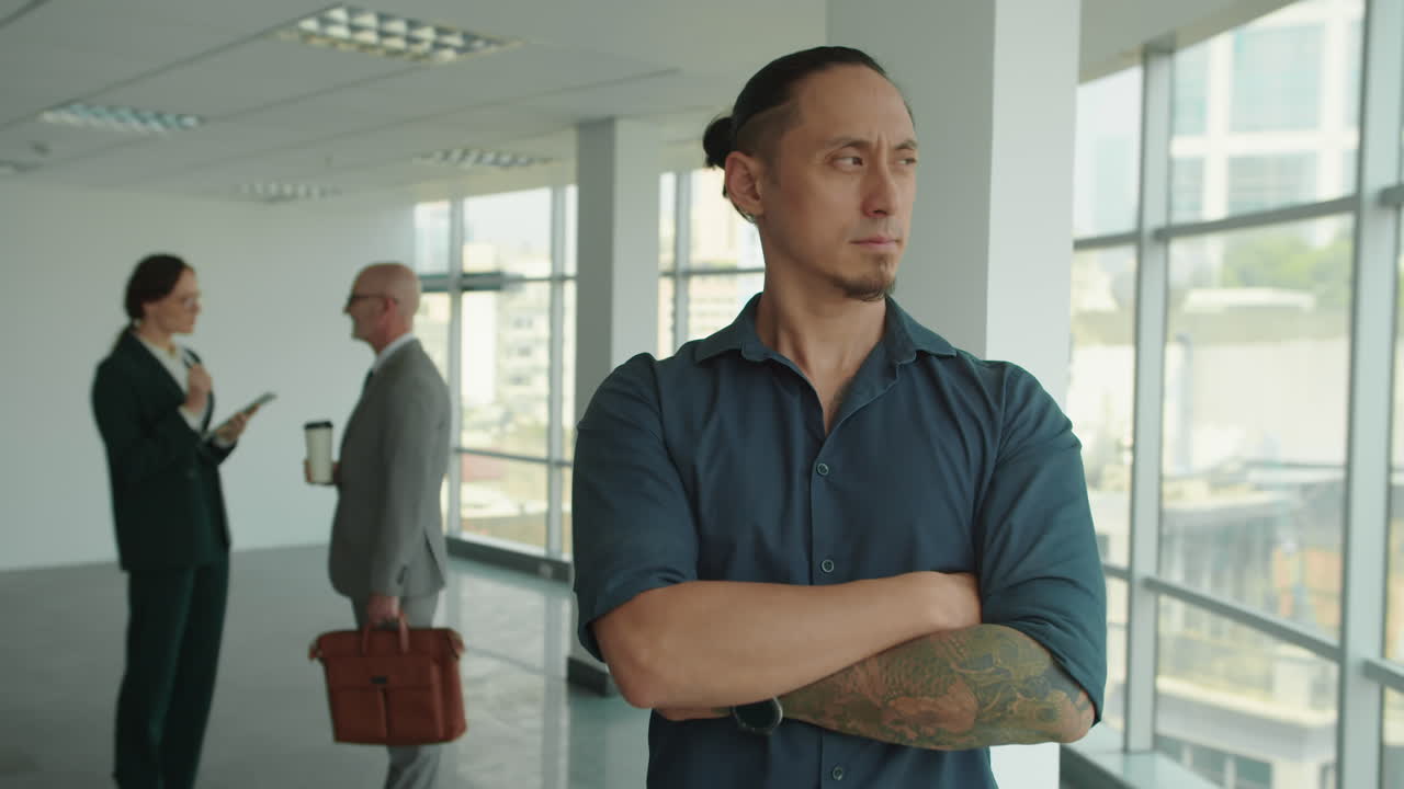 Portrait of Intercultural Product Manager with Tattoo at Coworking Space