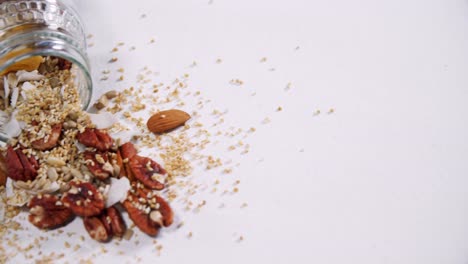 Dried-fruits-spilling-out-of-bottle-4k