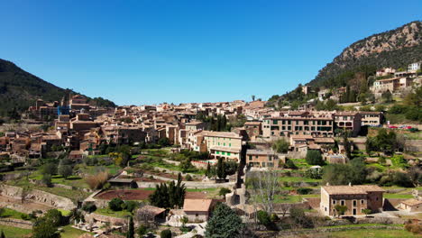 Slow-aerial-drone-reveal-of-historic-Deia-Village-on-span-ish-tropical-island-Mallorca