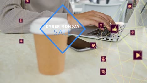 Animation-of-cyber-monday-sale-text,-connected-icons,-midsection-of-biracial-man-working-on-laptop