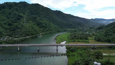 drone view of old bridge and river in bato, catanduanes, philippines