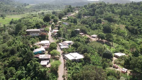 tropical forest and the small village of el guapo in miranda, venezuela, aerial view