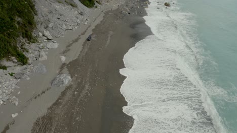 Aerial-view-above-sandy-coast-tilting-to-Qingshui-cliffs-Taroko-gorge-Hualien-County-Taiwan