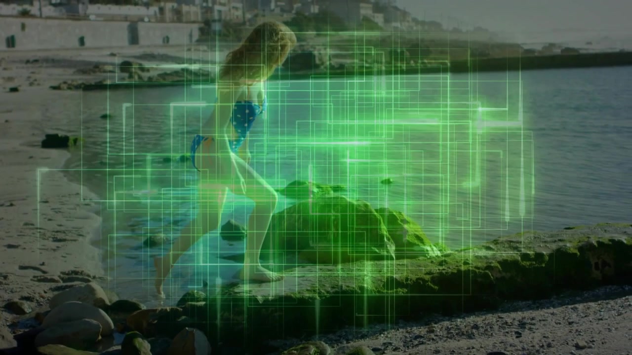 Woman walking on slippery rock while translucent neon grid flickering for technology tracking